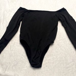Black one piece over the shoulder body suit